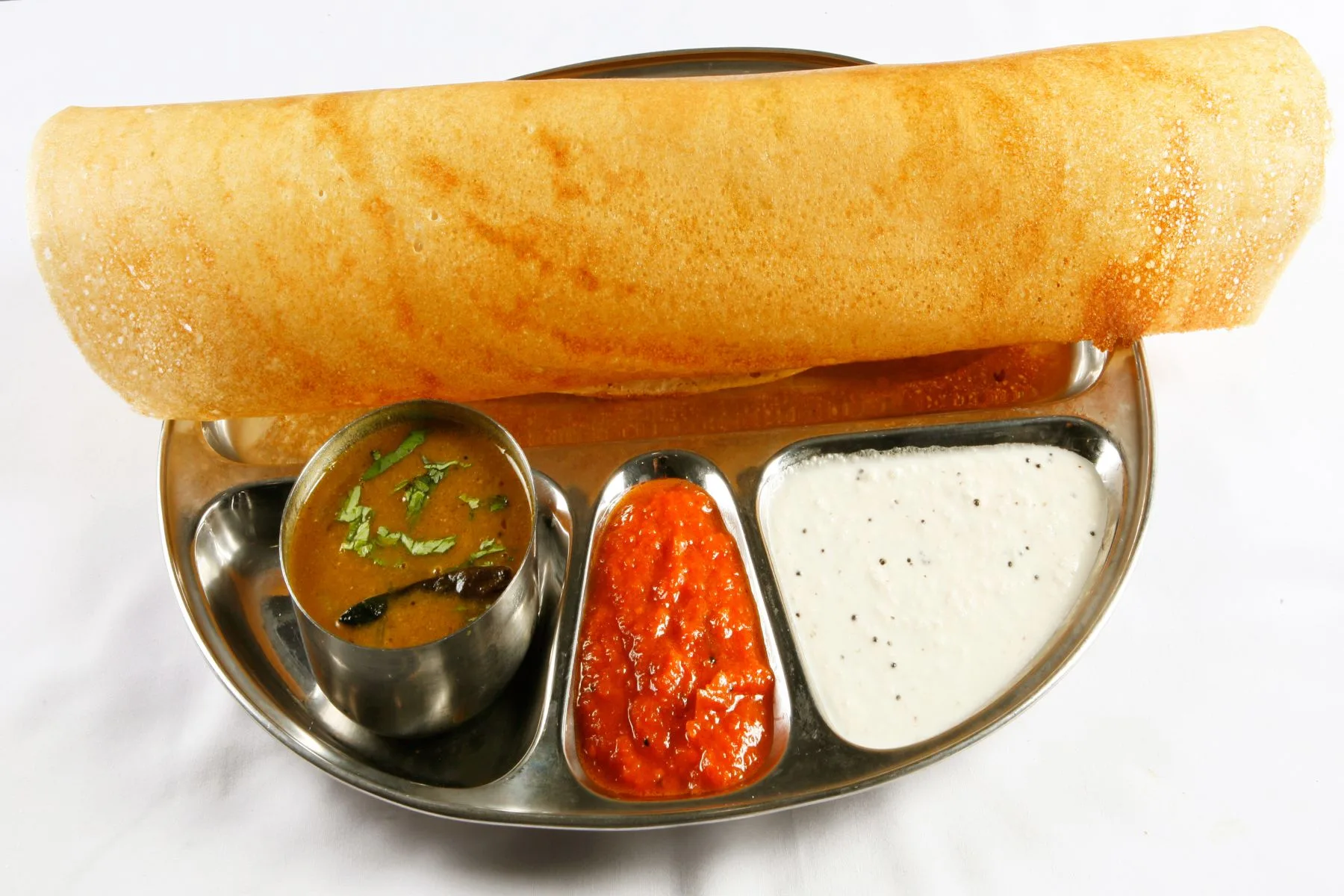 Crispy masala dosa served with chutney and sambar