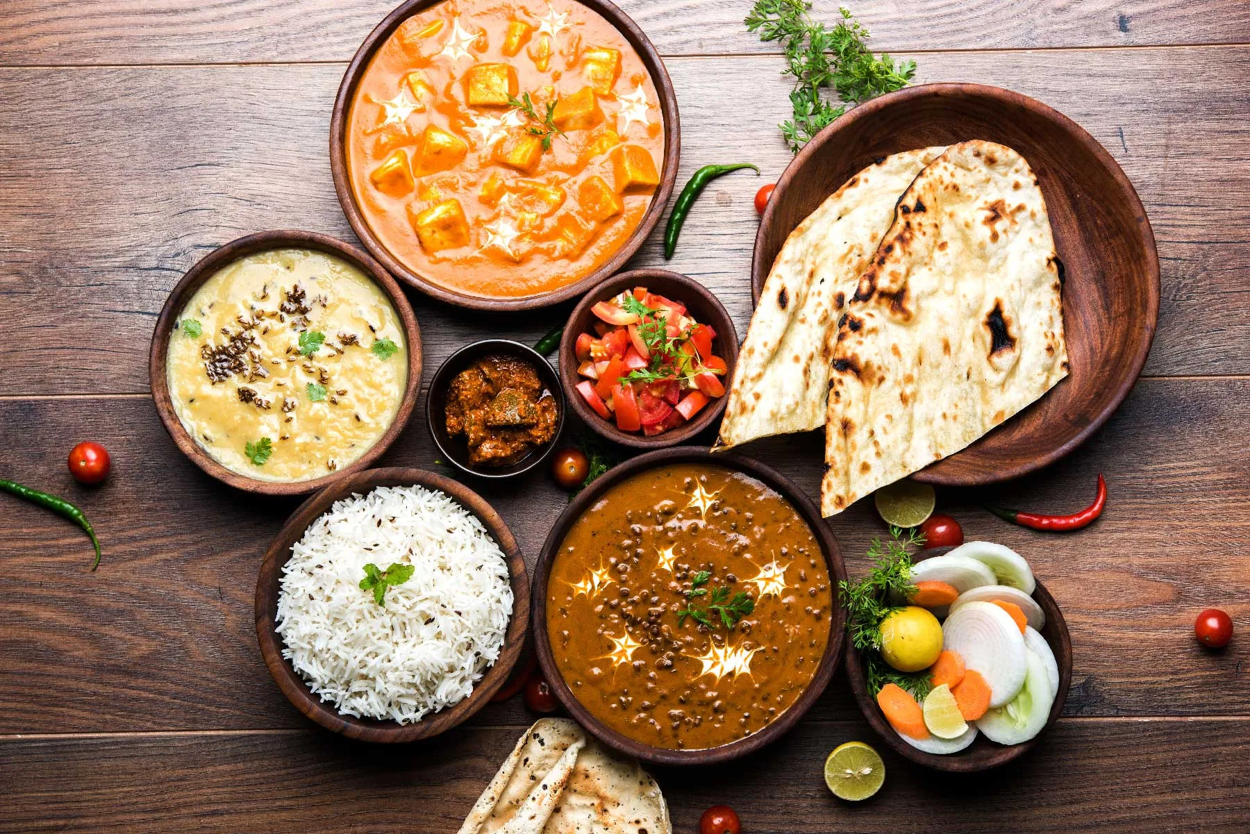 Colourful Indian curries and rice dishes prepared for catering