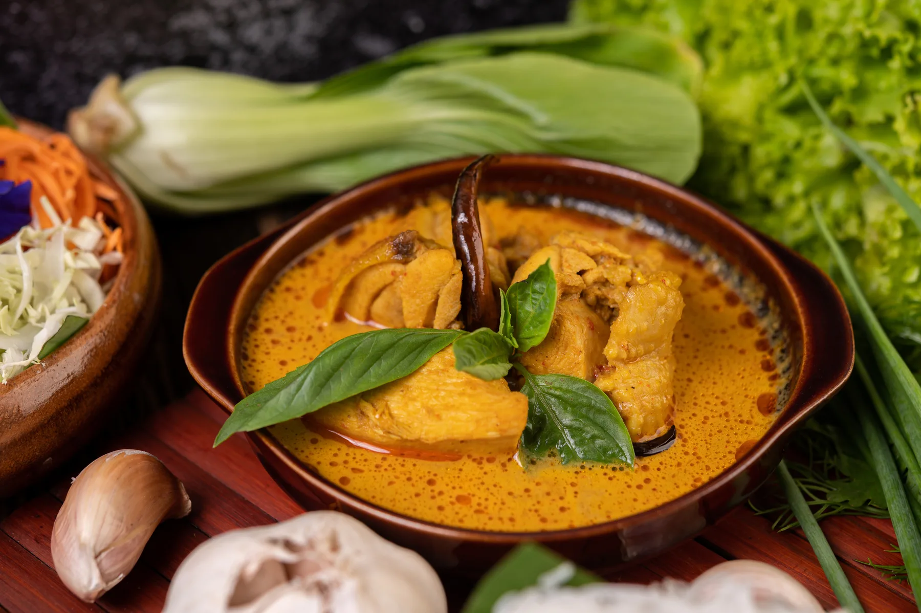 Indian fish curry served in a bowl with a coconut cream sauce