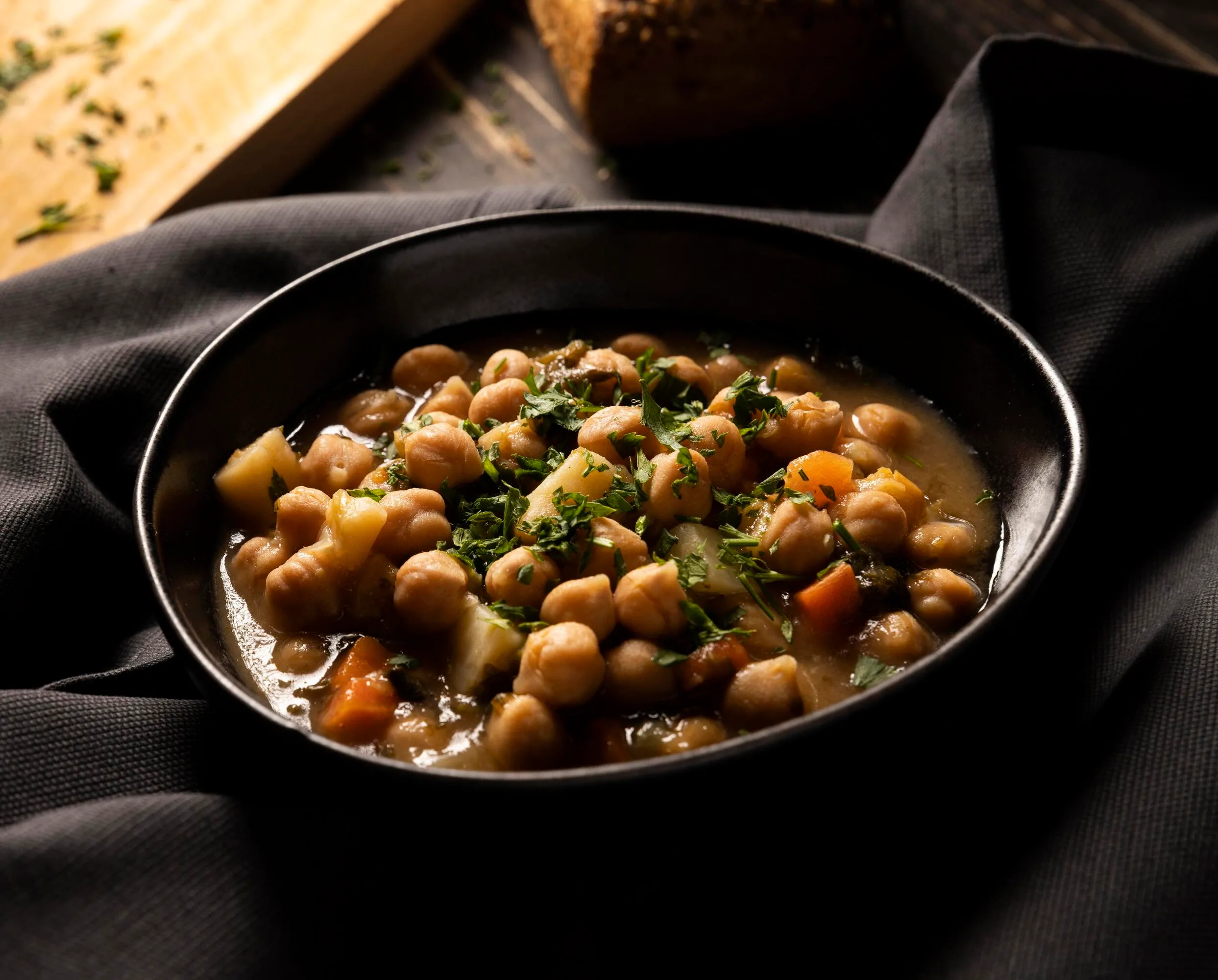 White cholay chickpea curry in a bowl with aromatic spices
