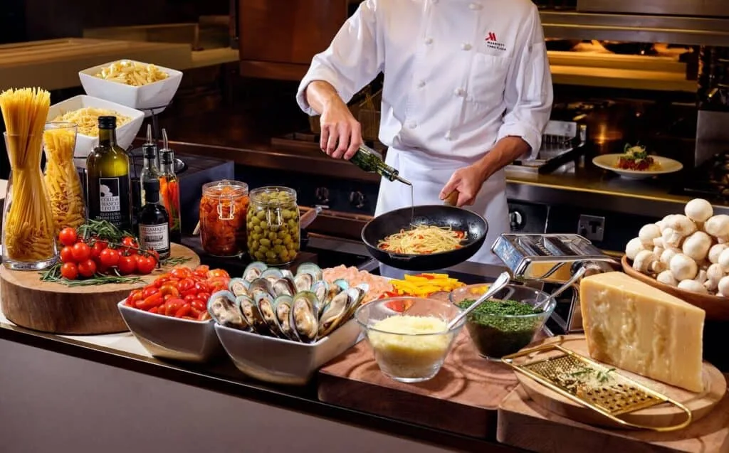 Traditional Indian buffet setup with curries, rice, and sides.