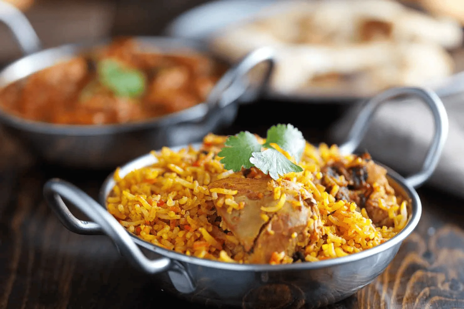 Indian biryani, rice and curry laid out for a menu tasting session