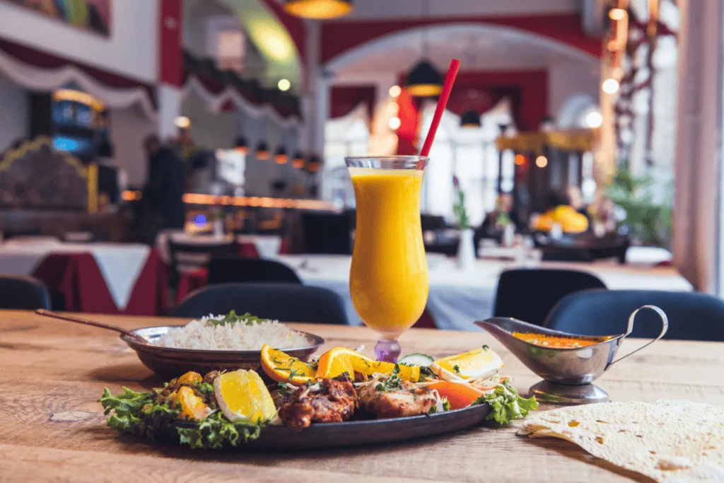 Signature Indian dishes from Raj’s Corner including curry, rice and naan