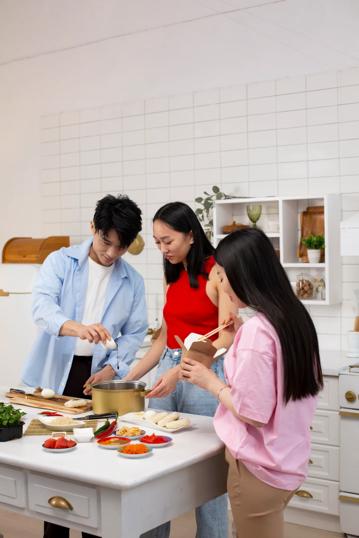 Couple cooking an Indian curry together in a home kitchen