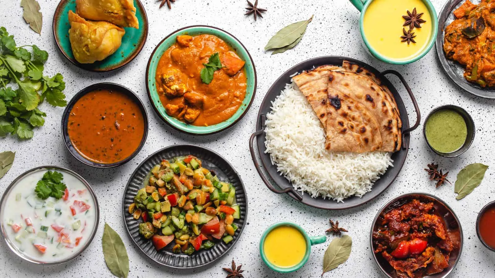 Indian dishes served with naan and rice, illustrating tips for enjoying Indian cuisine