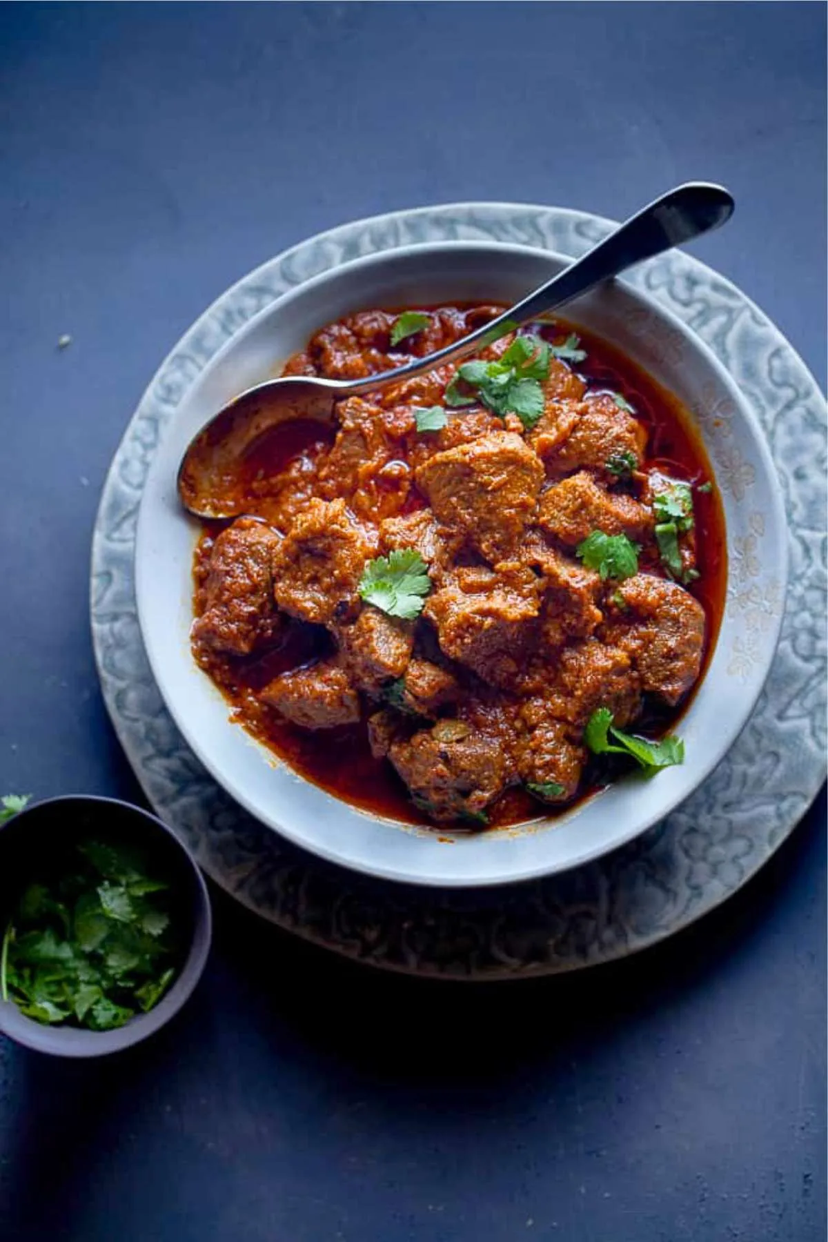 Close up of lamb rogan josh with slow cooked lamb in a red Kashmiri sauce