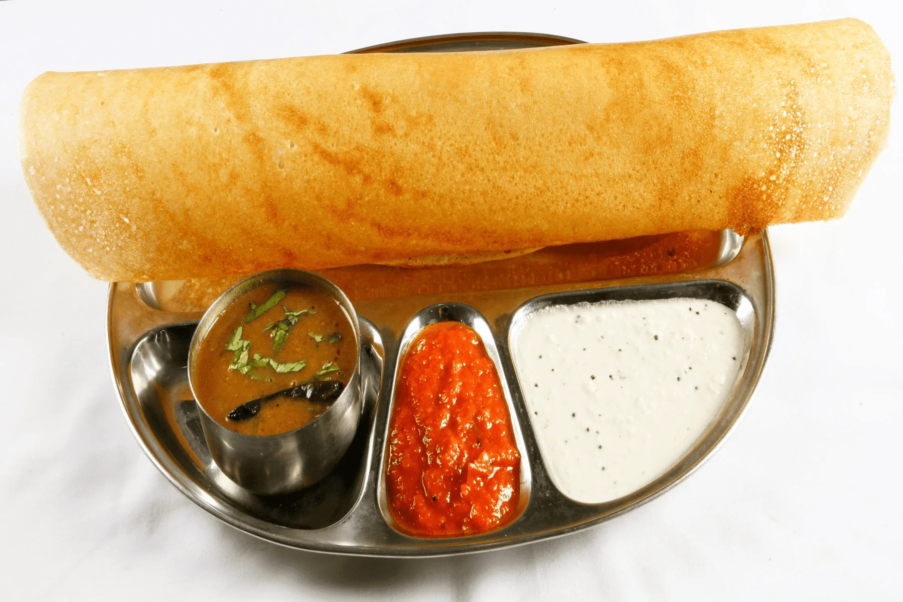 Crisp dosa served with sambar and coconut chutney, a South Indian favourite