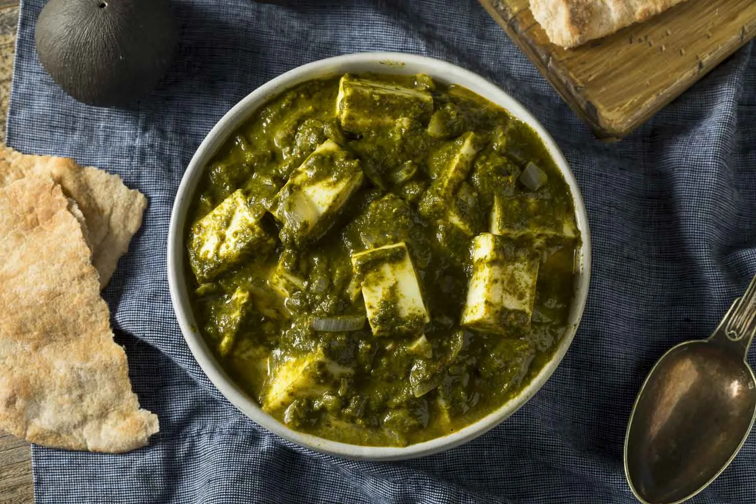 Palak paneer, cubes of paneer cheese in a creamy spinach sauce