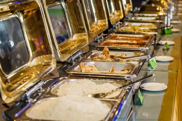A spread of Indian curries, rice and breads laid out for a catered event in Newcastle
