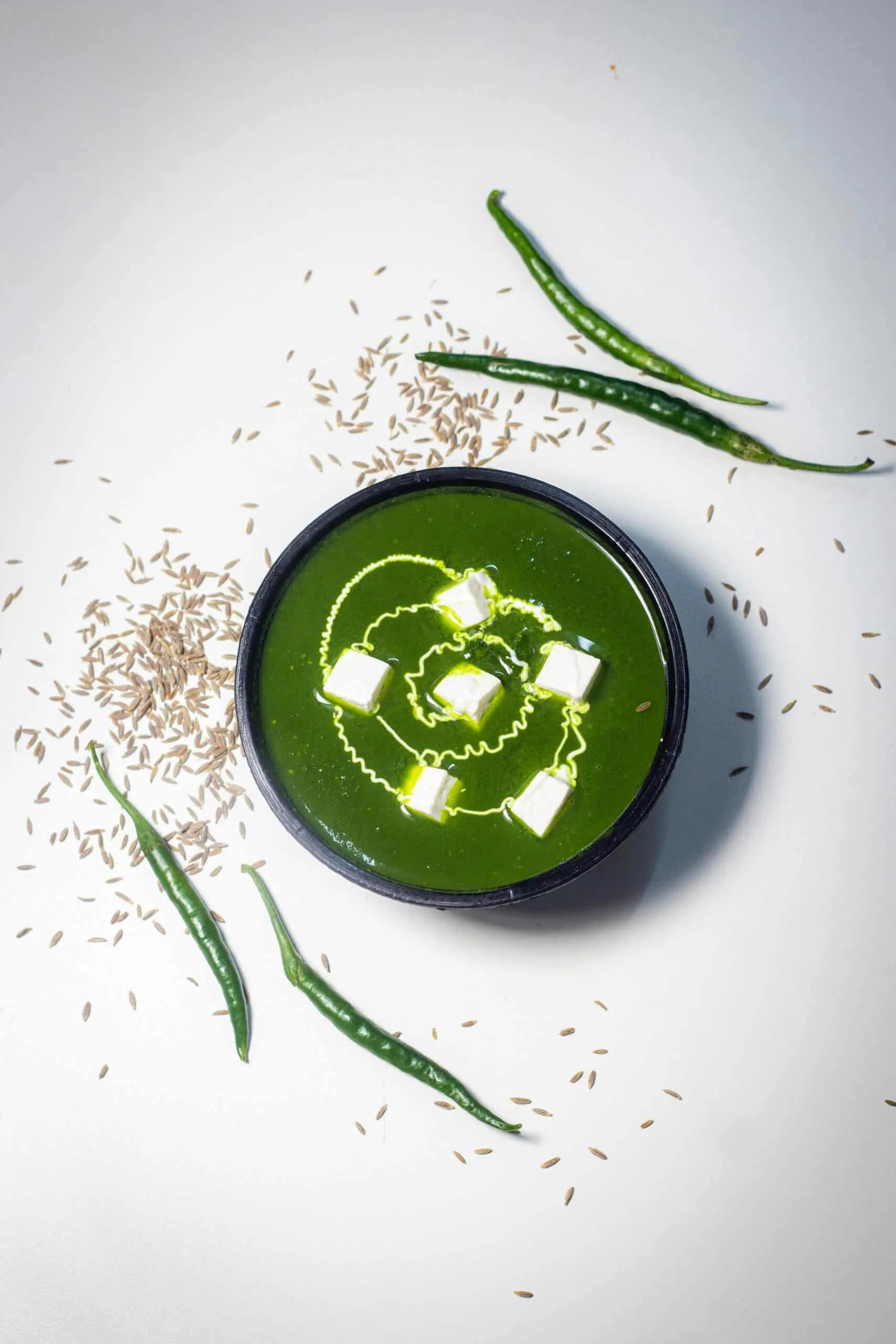 Bowl of palak paneer, a spinach curry with cubes of paneer
